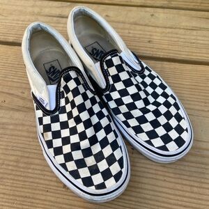 Vans black and white check slip-ons. Women's 9.0 Men's 7.5